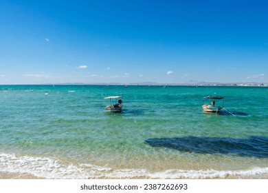Hammamet Tunisia, Beach and  boats on shallow water, view on Mediterranean sea 