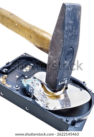 Hammer Breaking a Hard Drive for Data Destruction and Security
