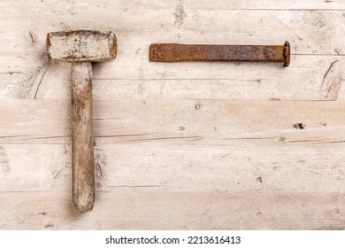 Hammer And Chisel Arranged On Wooden Workbench