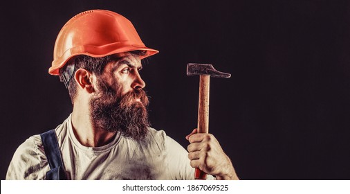 Hammer Hammering. Builder In Helmet, Hammer, Handyman Builders In Hardhat.