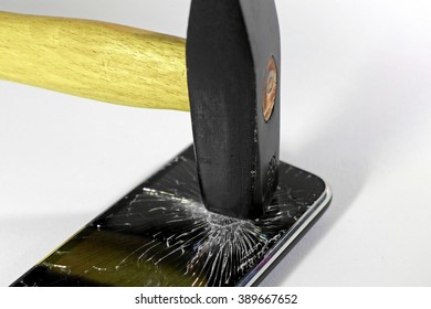 Hammer hitting smartphone