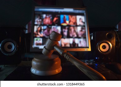 Hammer on the background of the computer screen, illegal site with adult content,