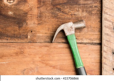 Hammer On Wood Background