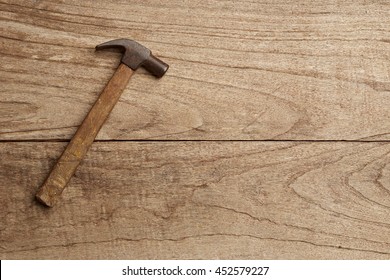 Hammer On Wood Background