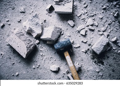 hammer smash with light brick mass break apart construction concept