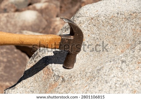 Hammer striking the ringing rocks in Upper Black Eddy, Pennsylvania, USA.