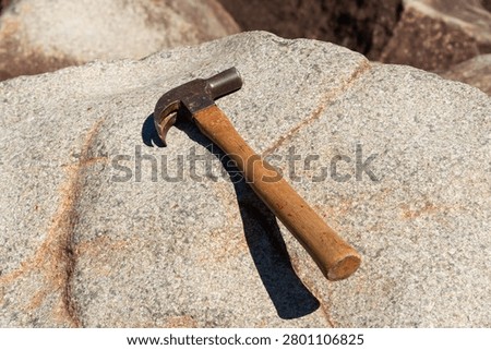 Hammer striking the ringing rocks in Upper Black Eddy, Pennsylvania, USA.