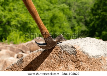 Hammer striking the ringing rocks in Upper Black Eddy, Pennsylvania, USA.