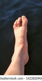 Hammer Toe With Water As The Background.