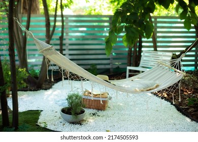 Hammock Hanging Hanging On Tree In Summer Garden. Cozy Exterior Backyard. Hammock In Boho Style Hanging On Tree. Concept Of Recreation Outdoor. Comfortable Cozy Hygge Place For Weekend Relax In Yard. 