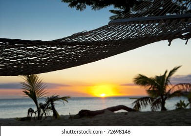 Hammock On Beach At Sunset In Fiji Islands