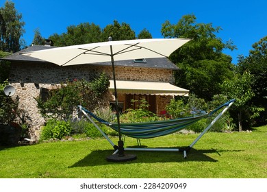 Hammock ready to relax in the sun in French garden