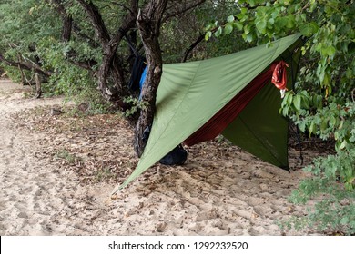 Hammock With Tarp Near The Bitch. Camping With Hammock