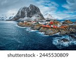 Hamnoy fishing village with red rorbu houses in Norwegian fjord in winter. Lofoten Islands, Norway