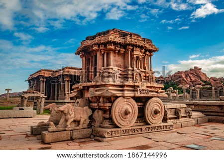 hampi stone chariot the antique stone art piece from unique angle with amazing blue sky image is taken at hampi karnataka india. it is the most impressive and truly splendid architecture in hampi.