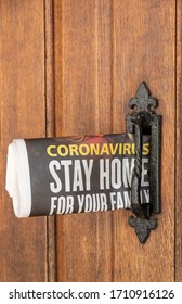 Hampshire, UK.2020. Newspaper Delivery With Government Message. Coronavirus Stay Homem Issue Into A Letterbox Of A Hampshire Home.