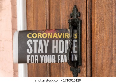 Hampshire, UK.2020. Newspaper Delivery With Government Message. Coronavirus Stay Homem Issue Into A Letterbox Of A Hampshire Home.