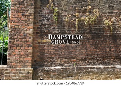 Hampstead Grove Street Sign On Red Brick In Hampstead London