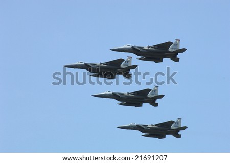 HAMPTON, VA - MAY 15: Four USAF F-15s fly in formation as they perform during the Langley AFB airshow on May 15, 2005 in Hampton, Virginia.