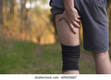 Hamstring Sprain Or Cramps. Running Sports Injury With Male Triathlete Runner.2