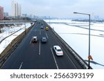 Han River filled with snow and ice and  Gangbyeonbuk-ro