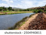 Hanapepe, Kauai, Hawaii US - July 24, 2024: View of Hanapepe River from entrance to Hanapepe Swinging Bridge, Kauai, Hawaii on a sunny day, no people