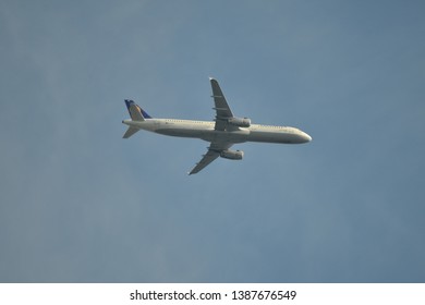 Hanau, Germany - 2019.05.03 airplane on sunny sky approaching Frankfurt international airport