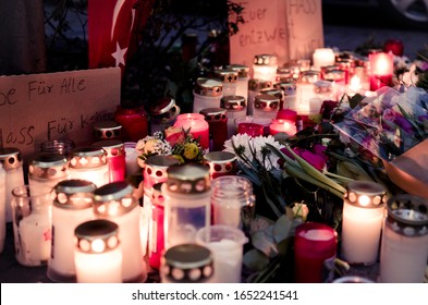 Hanau, Germany - February 20 2020: Flowers & candles as a tribute to the victims of mass shooting in Hanau, Germany by a right extremist.