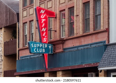 HANCOCK, MI - JULY 2022 - A Telephoto Close Up Shot Of The Nutini's Supper Club Sign In Small Town Hancock During A Summer Evening