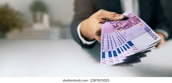 hand with 500 euro banknotes. bank money loan, consumer credit and quick loans. banner with copy space