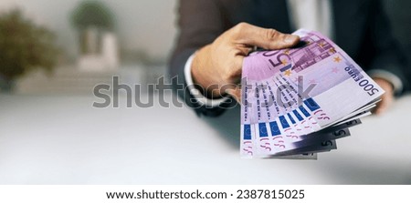 hand with 500 euro banknotes. bank money loan, consumer credit and quick loans. banner with copy space