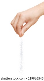 Hand Adding Salt On A White Background