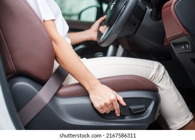 Hand adjust car seat before drive on the road . Ergonomic and safety transportation concept - Shutterstock ID 2167586311