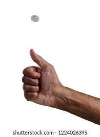 Hand Of An African Man Tossing A Coin Isolated On White