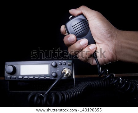 hand of Amateur radio holding speaker and press for radio communication theme