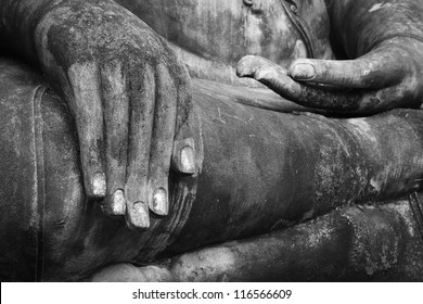 Hand of an ancient Buddha image at Sukhothai historical park, Thailand (black and white)