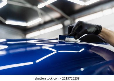 Hand Applying Of Nano Ceramic Protective Coat To Protect Car From Scratches. Process Of Apply Ceramic Layer On Body Car Using Sponge Close-up In Detailing Auto Service