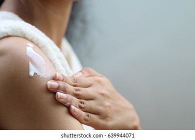 Hand And Arm Of Lady That Doing Apply Whitening Lotion On Tantalum Of Her Skin