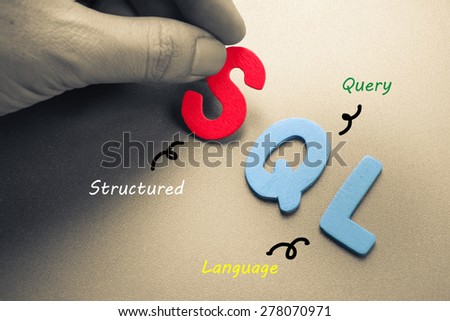 Hand arrange wood letters as SQL computer language