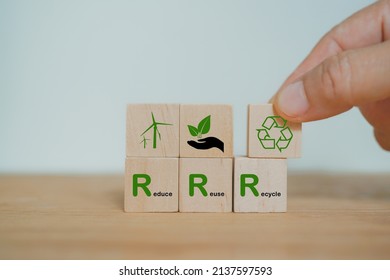 hand arranged wooden cube block over reduce, reuse and recycle text for save world, environmental concept - Shutterstock ID 2137597593