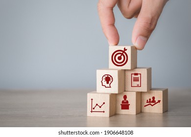 Hand Arranging Wood Block Stacking With Icon Arrow And Business,targeting The Business Concept.