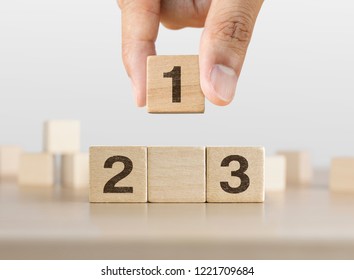 Hand Arranging Wooden Blocks Stacking As A Podium On White Background. Success, Win, Winner, Victory Or Top Ranking Concept.