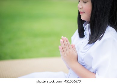 Hand Of Asian Girl Praying In The Park