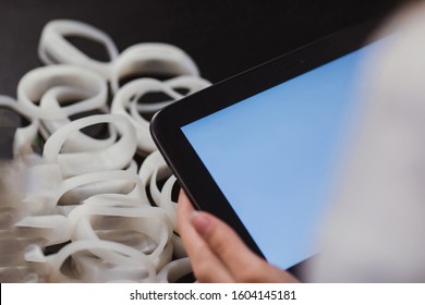 A Hand Of Assistant Holding A Blank Large Display Of A Professional Tablet On Event Or Exhibition. Concept Of Business Assistance, Type Your Text.