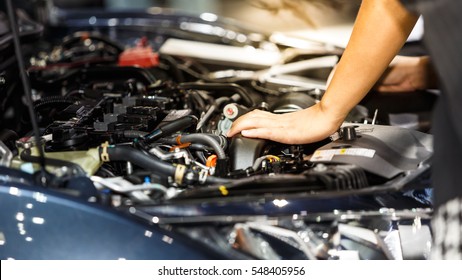 Hand of auto mechanic with a wrench. Car repair