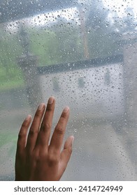 a hand with a background Natural pattern of raindrops.

