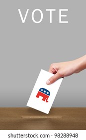 Hand With Ballot And Wooden Box With Republican Party Icon