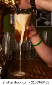 Hand Bartender Pouring Large Lager Beer. Light Cold Filtered Beer In Glass Beaker.