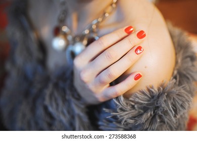 the hand beautiful young girl the shoulder and red bright manicure   picture cat the nails