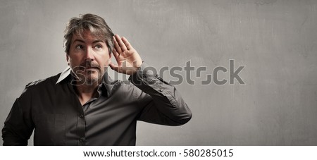 Hand behind ear of hearing eavesdropping man. Deaf people.